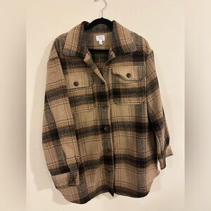 Flannel like button up. Super warm!! Over sized fit for sure